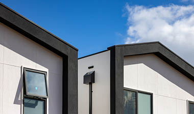 Hardie's Brushed Concrete Cladding vs Blueboard